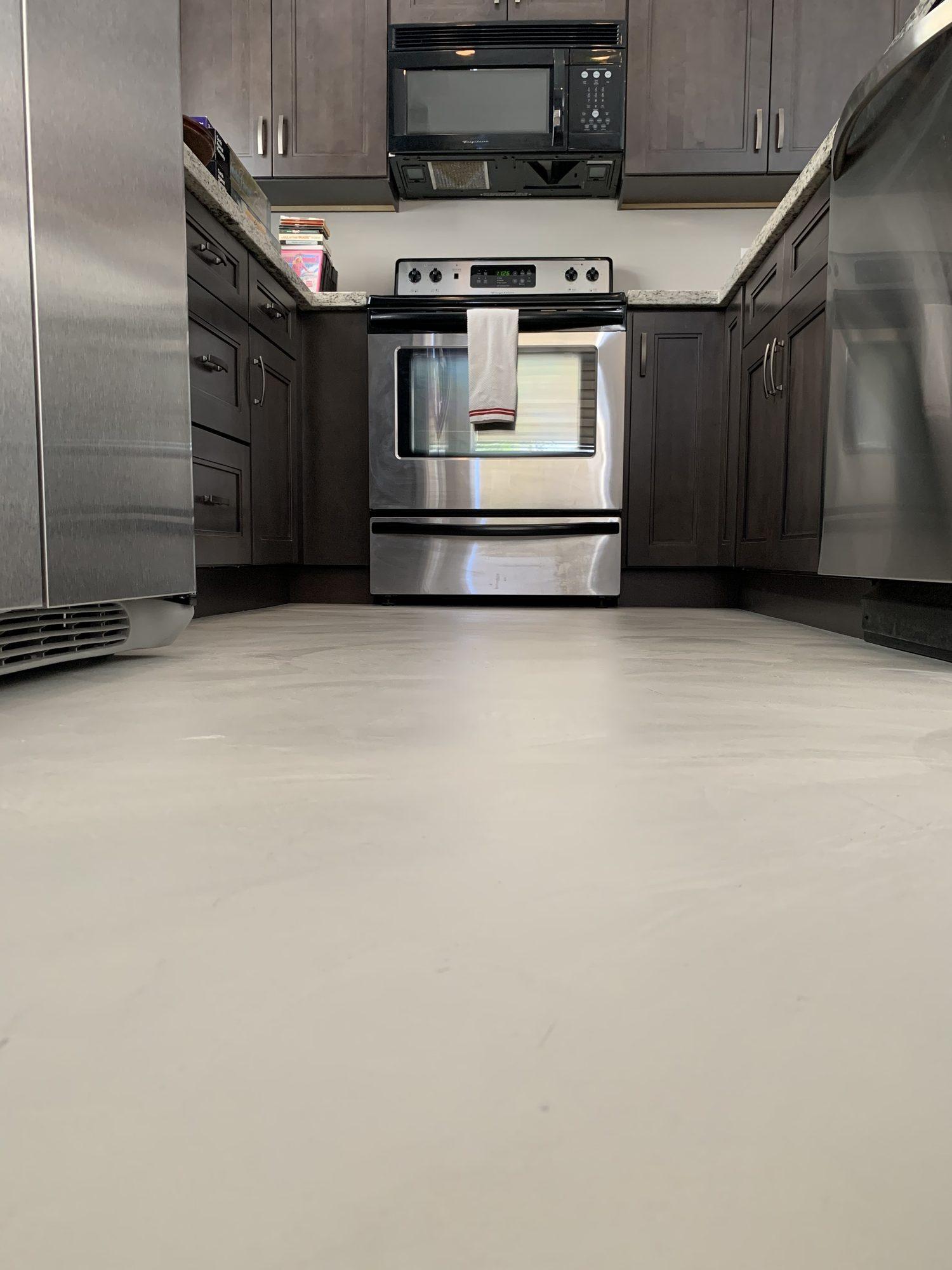 Continuous microcement kitchen floor in a Greenwich residence, Connecticut