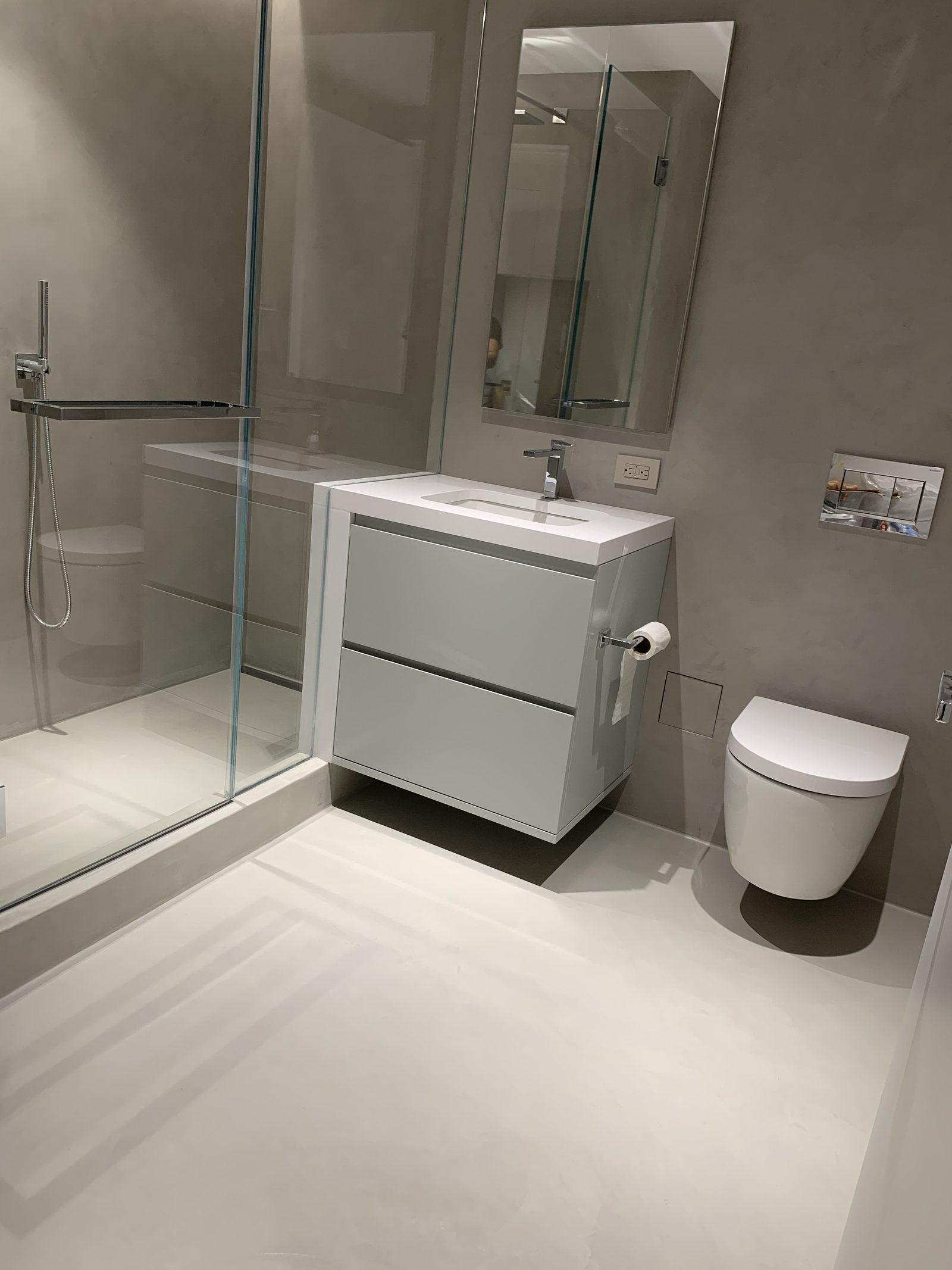 Microcement bathroom with seamless walls and floor in a Manhattan apartment, New York