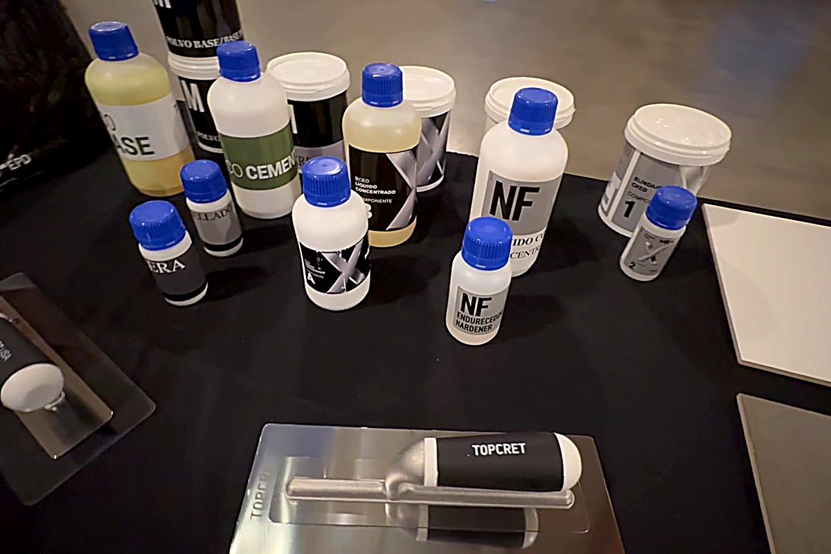 Topcret products and a branded trowel laid out for training